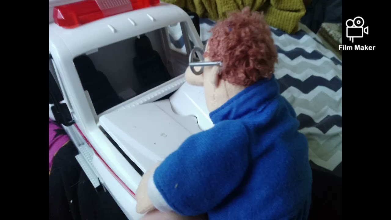 Postman pat driving a WWE wrestling ambulance 
