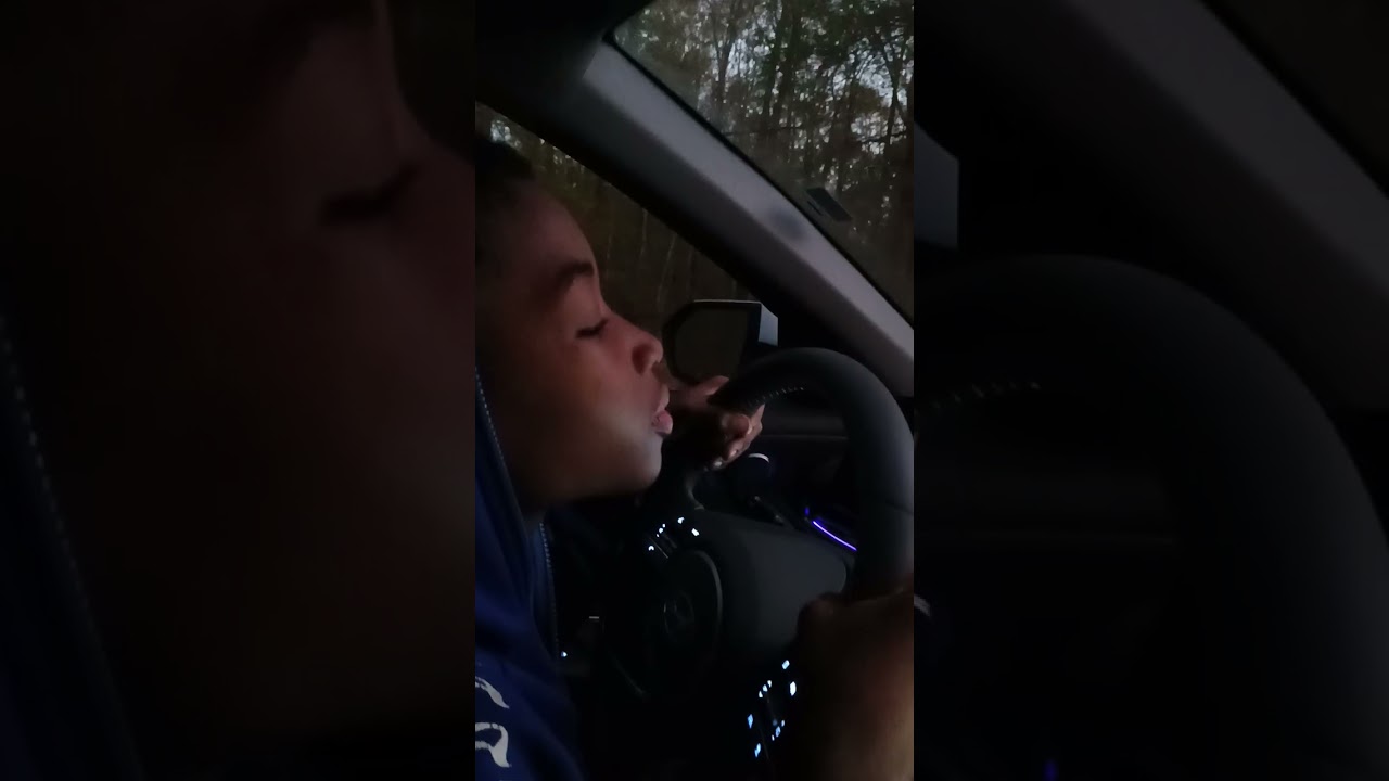 Teaching my God son how to drive . He got it