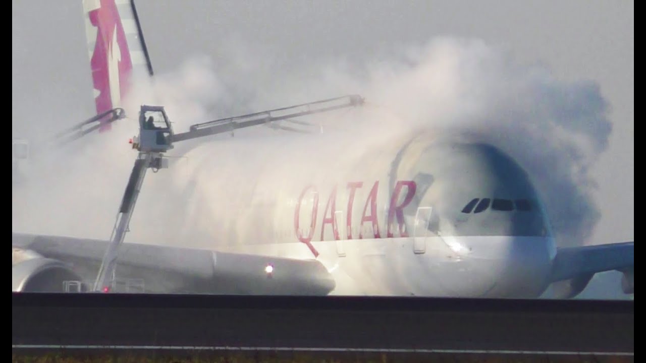 De-icing the A380 Qatar Airways in winter in Paris CDG airport