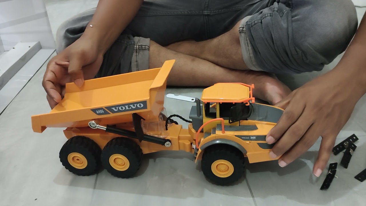 unboxing Volvo E581-003 dump truk