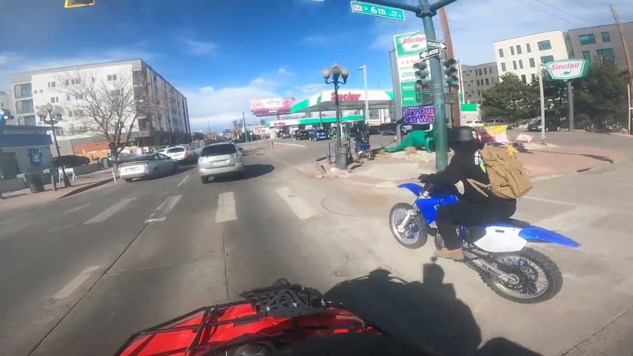 Quad nd Dirtbikes cruising Downtown Denver