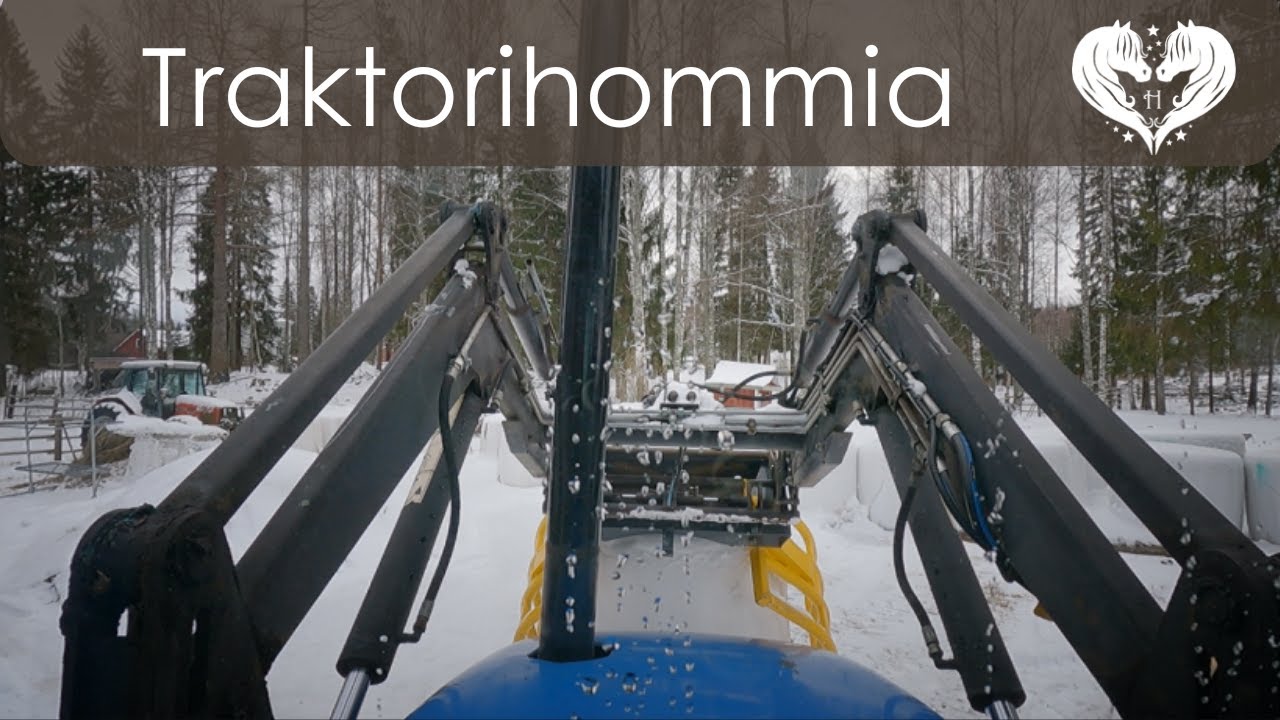 Paalin siirtoa traktorilla