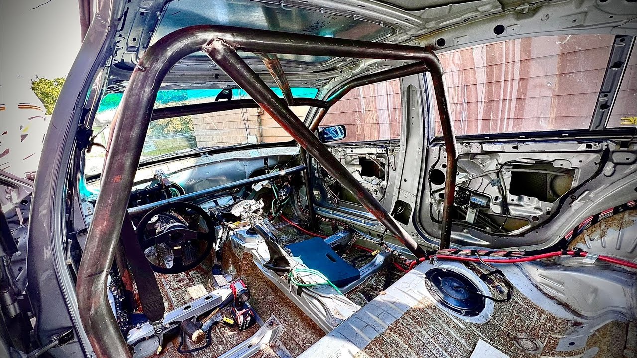 Installing roll cage in budget endurance race car - BMW e46