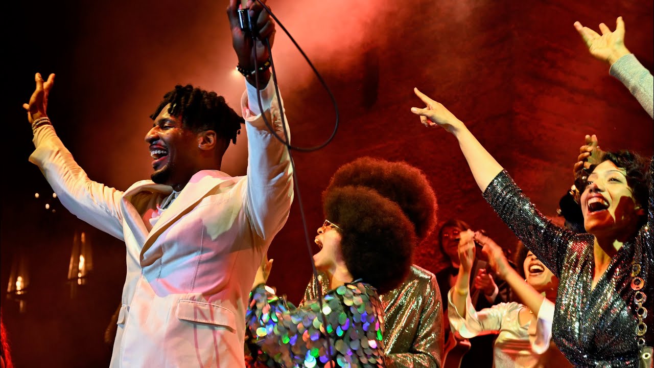 Jon Batiste and his Curtis Family, up on stage with him for Big Money