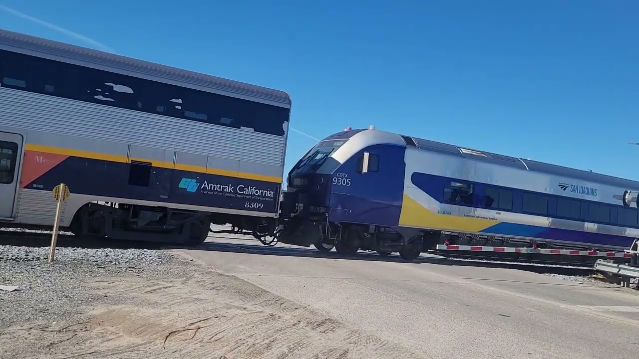 Amtrak Gold Runner 710 passing golden state Frontage road. Fresno, California.