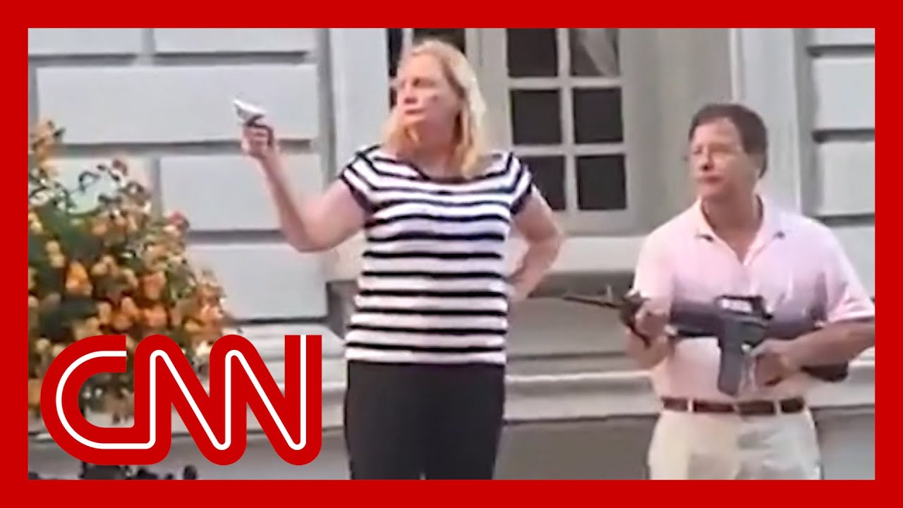 Couple pulls weapons on protesters cutting through their private street