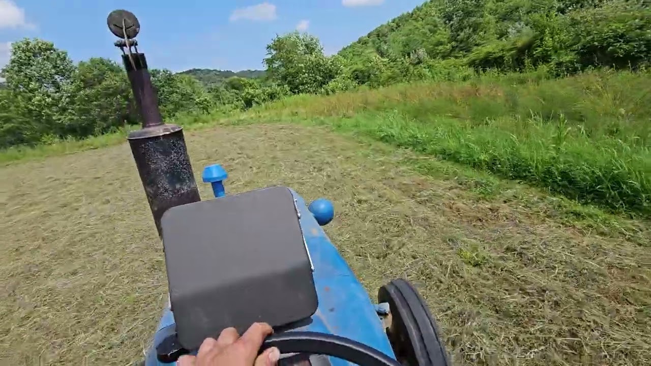 raking hay with the ford 3000 and 20ft v-rake