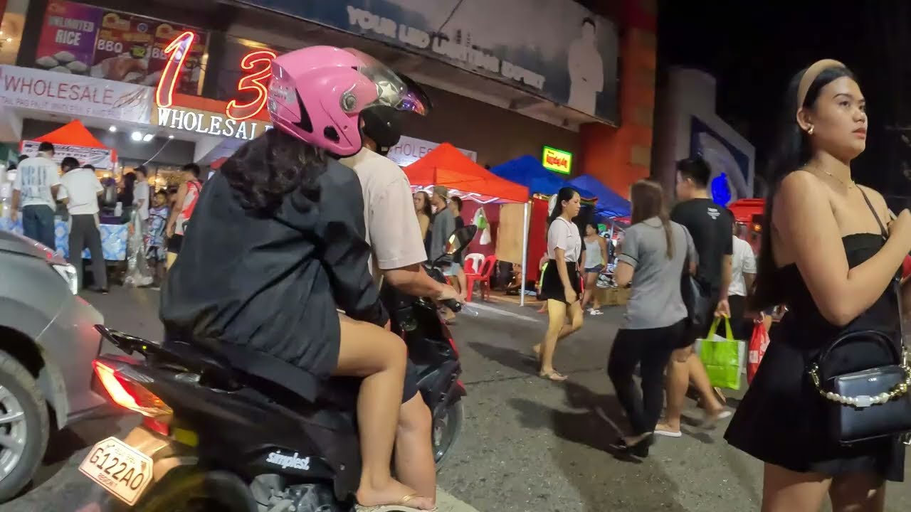 Bicycle tour around Colon Night Market, Cebu, Philippines.