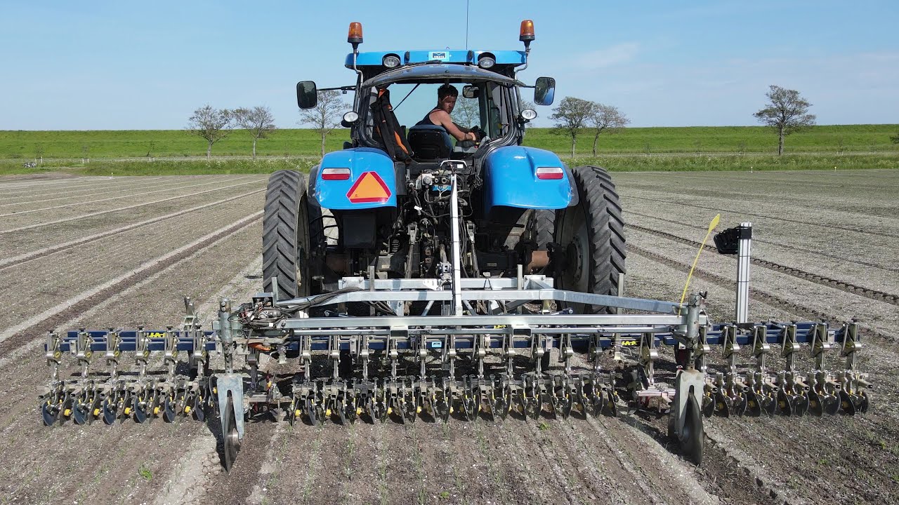 New Holland T6.160 cultivating using Raven GPS: tractor-, camera- and Isobus implement guidance!