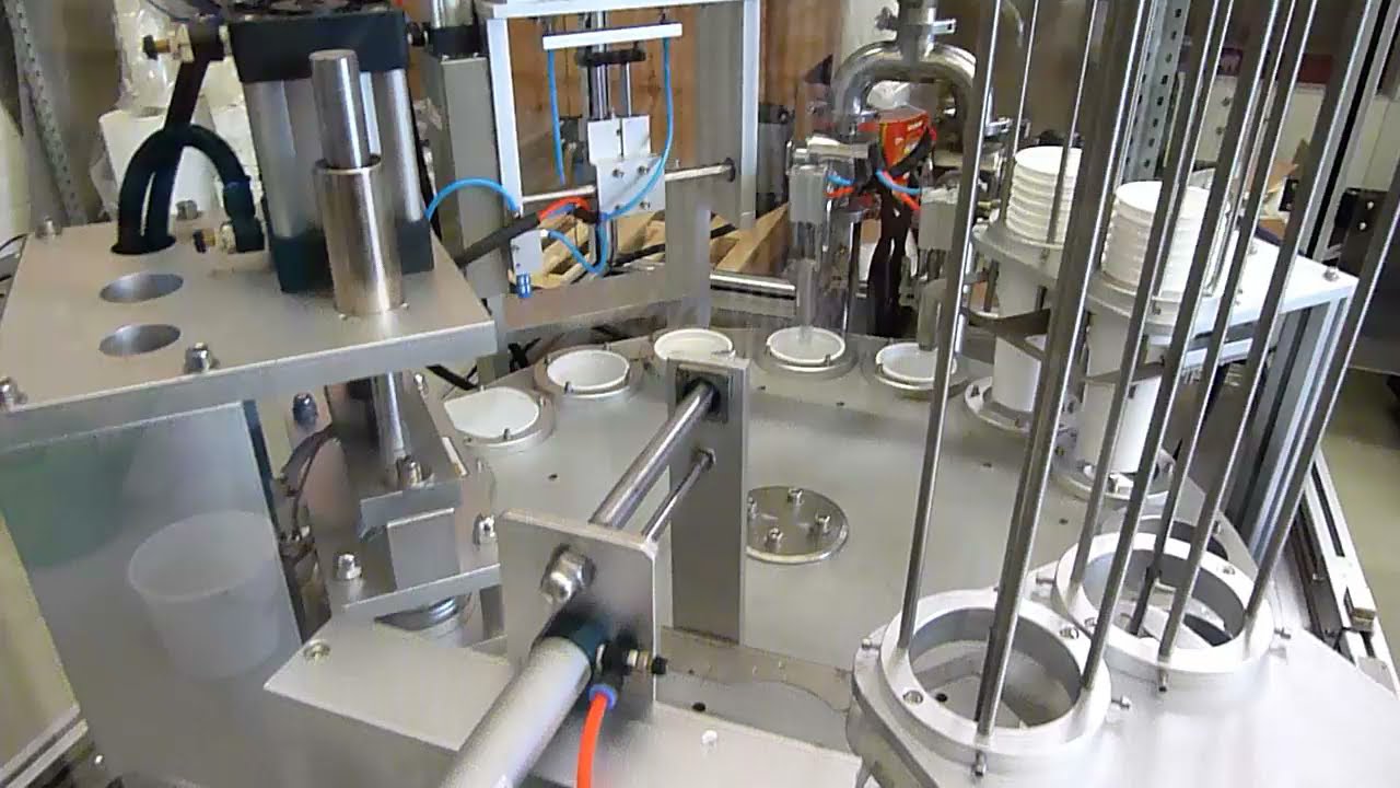 AMTEC RT8 20 - Rotating Cup Filling and Closing Machine