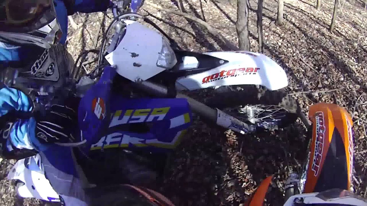 2 bikes between 2 trees  KTM 450 XCW,  HUSABERG 390 FE
