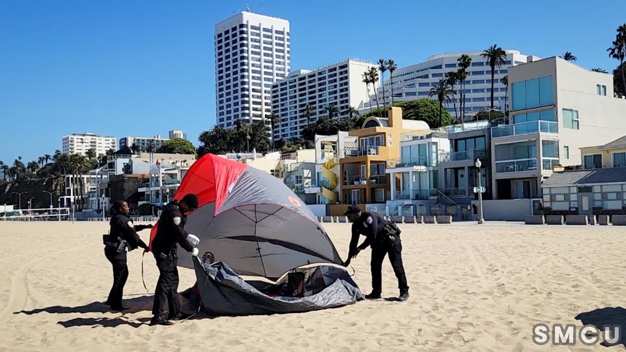 S.M. Police Officers Dismantle a Tent at Beach, Issuing Warning Notice Amid Homelessness Efforts