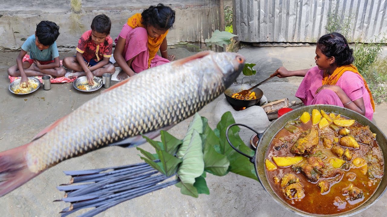 Indian tribe children eating & her sister cooking river mrigel fish recipe with dudh kochu