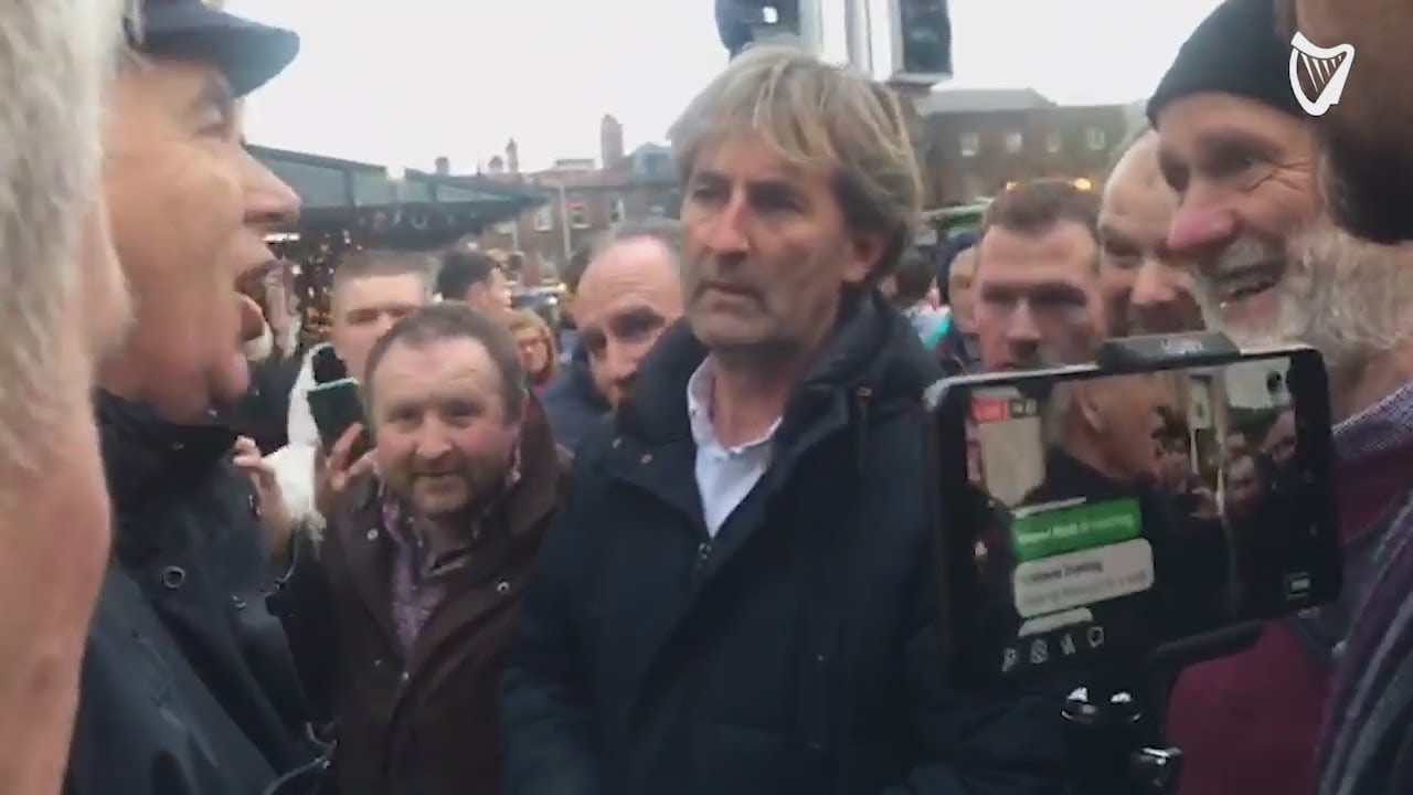 Protesting farmers try to break through Gardai blockade on Kildare Street to get to Leinster House