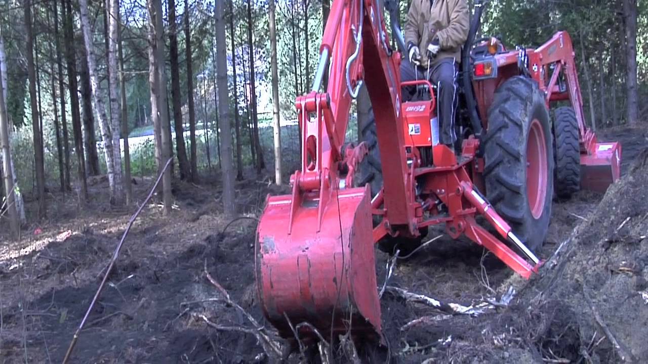 Kubota L4400 BH92 Backhoe Digging Large Tree Stumb Out