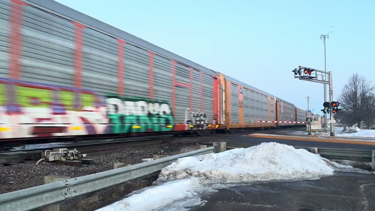 CN2258 ES44DC leads E240 through Ladysmith, Wi. Trailing Unit BNSF7928 ES44C4-T4C helps Pull E240 