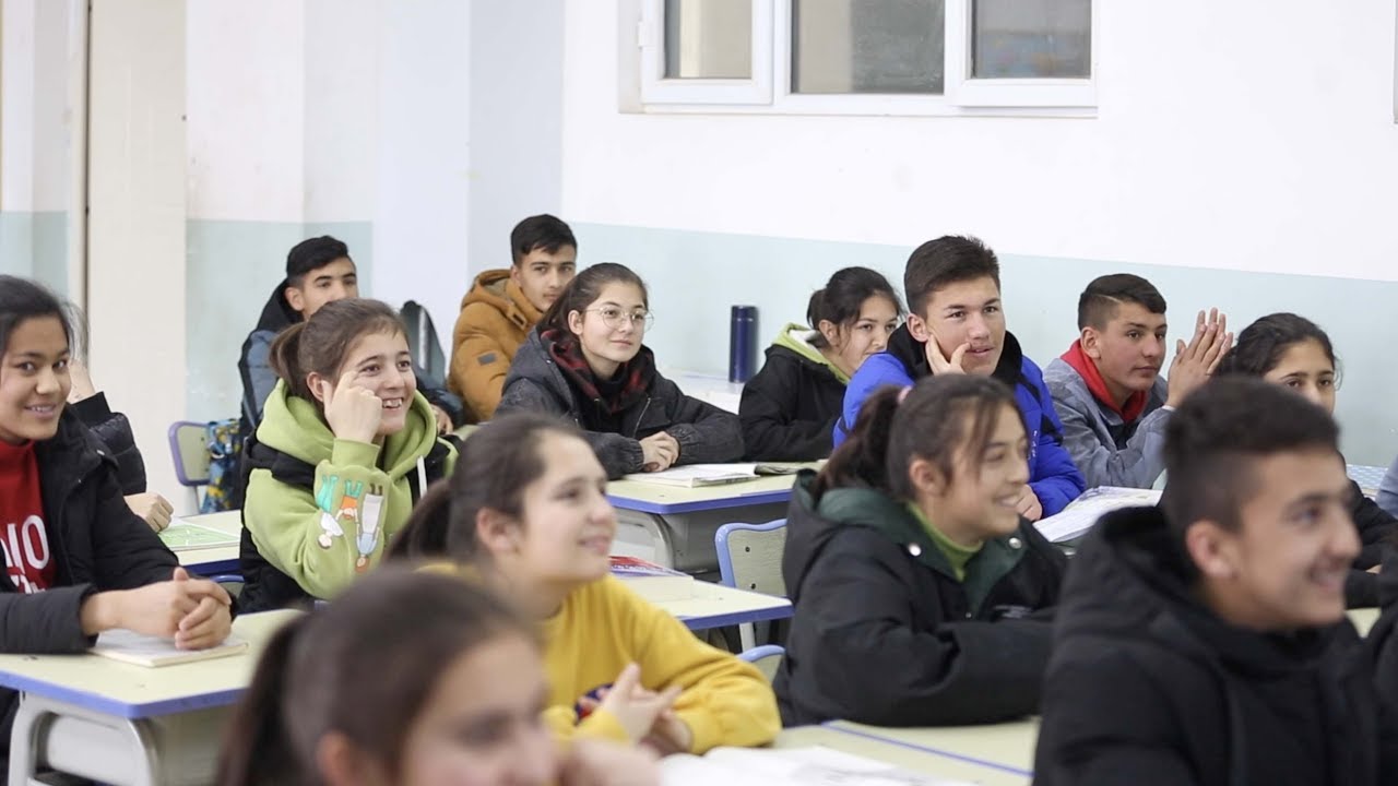 What changes have boarding schools brought to students in Xinjiang?