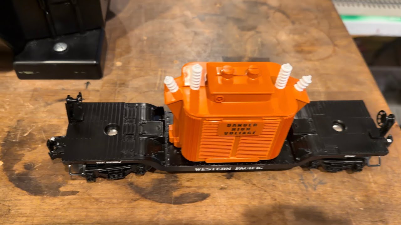 Train time I super glued the Lionel couplers on this flat car Danger High Voltage Western Pacific 