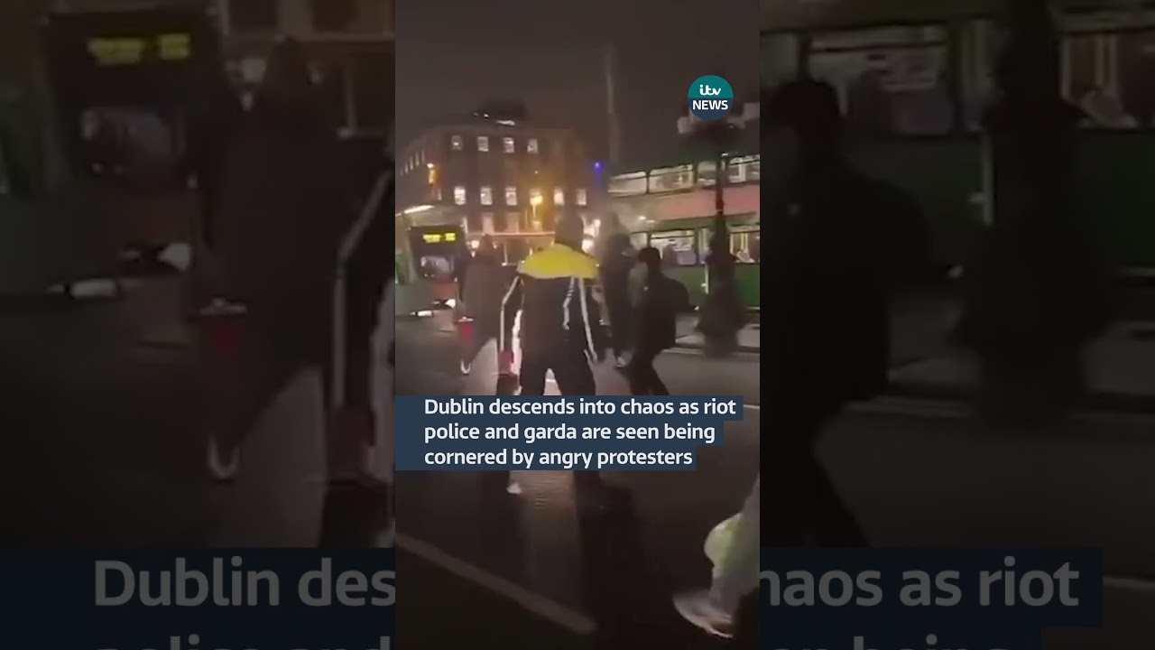 Dublin descends into chaos as riot police and garda are seen being cornered by angry protesters