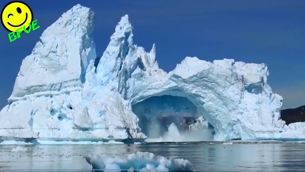 Iceberg Collapse - Big Bridge of Ice Collapses into the Ocean - Iceberg Breaking up