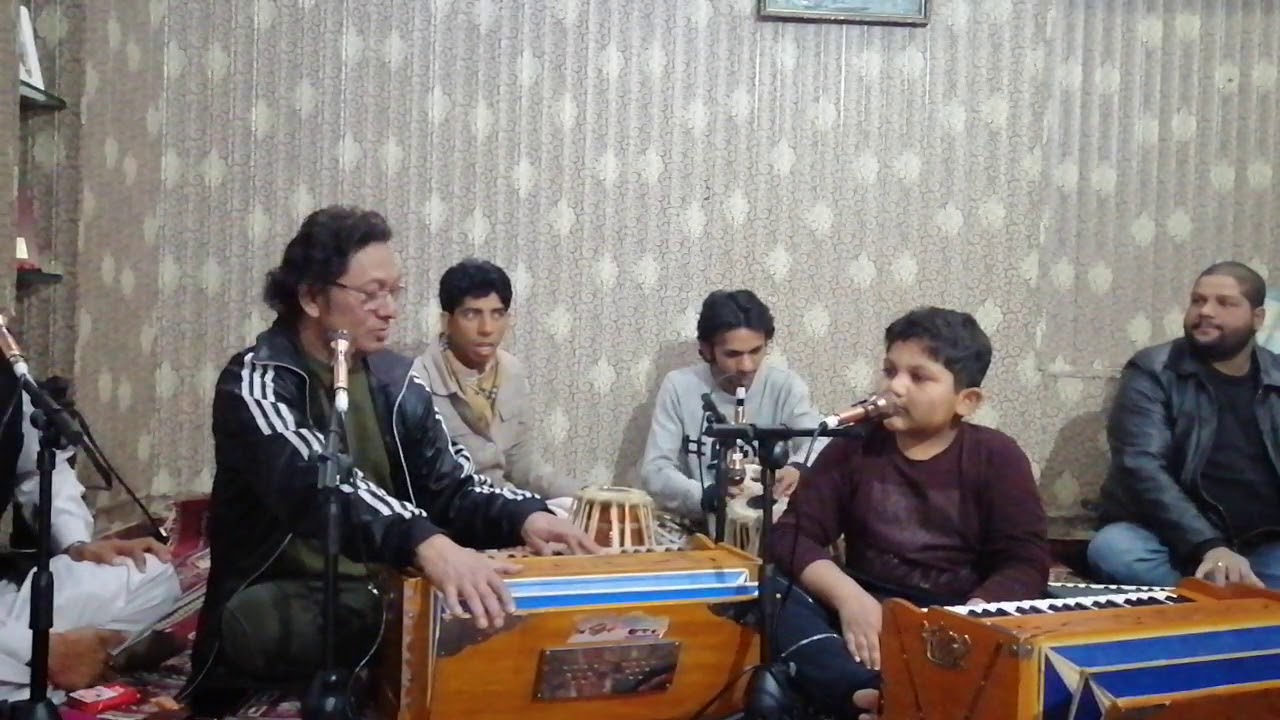 Ustad dildar Hussain teaching his grandson basil Hussain