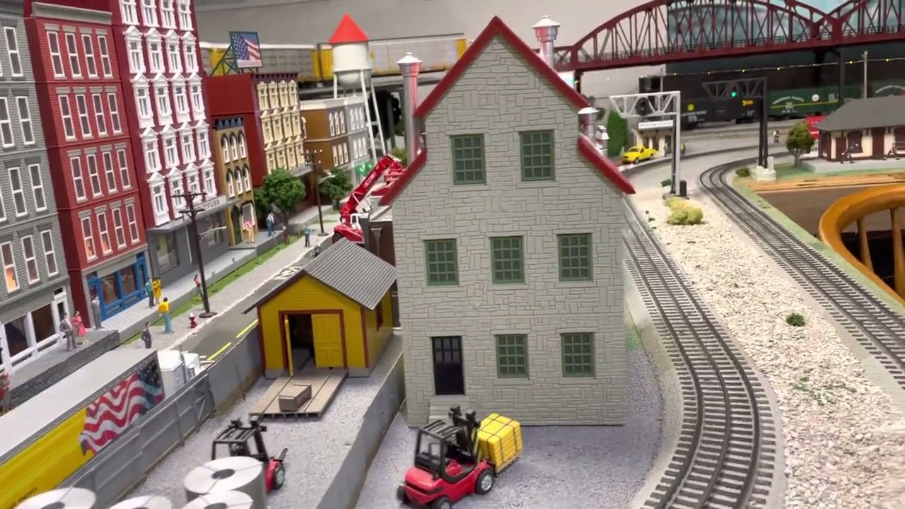 Train layout O gauge fun! With lots of action and eye candy both colorful and bright!