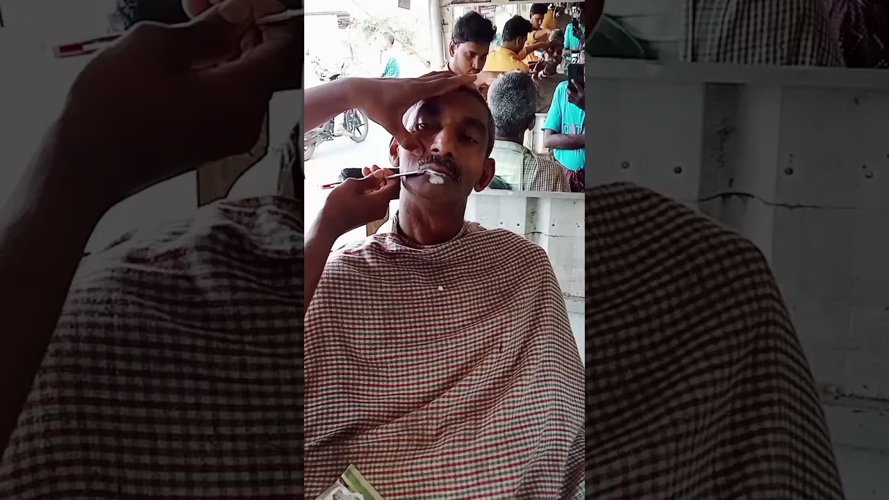 old man beard shave in barber shop
