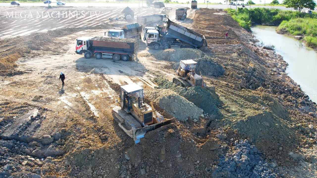 Project Completion, Operator Specializing Power bulldozer, Huge dump truck unloading dirt