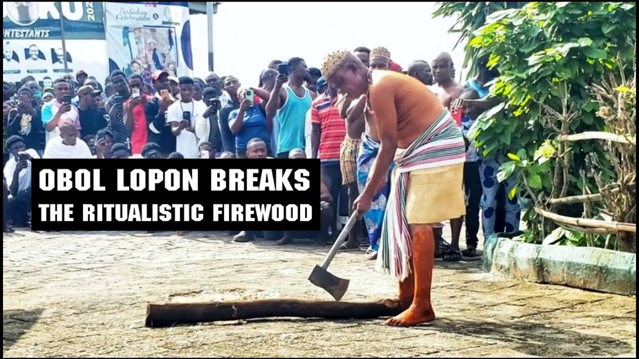 Obol Lopon Breaks Firewood for the Sacred Okondel Ritual