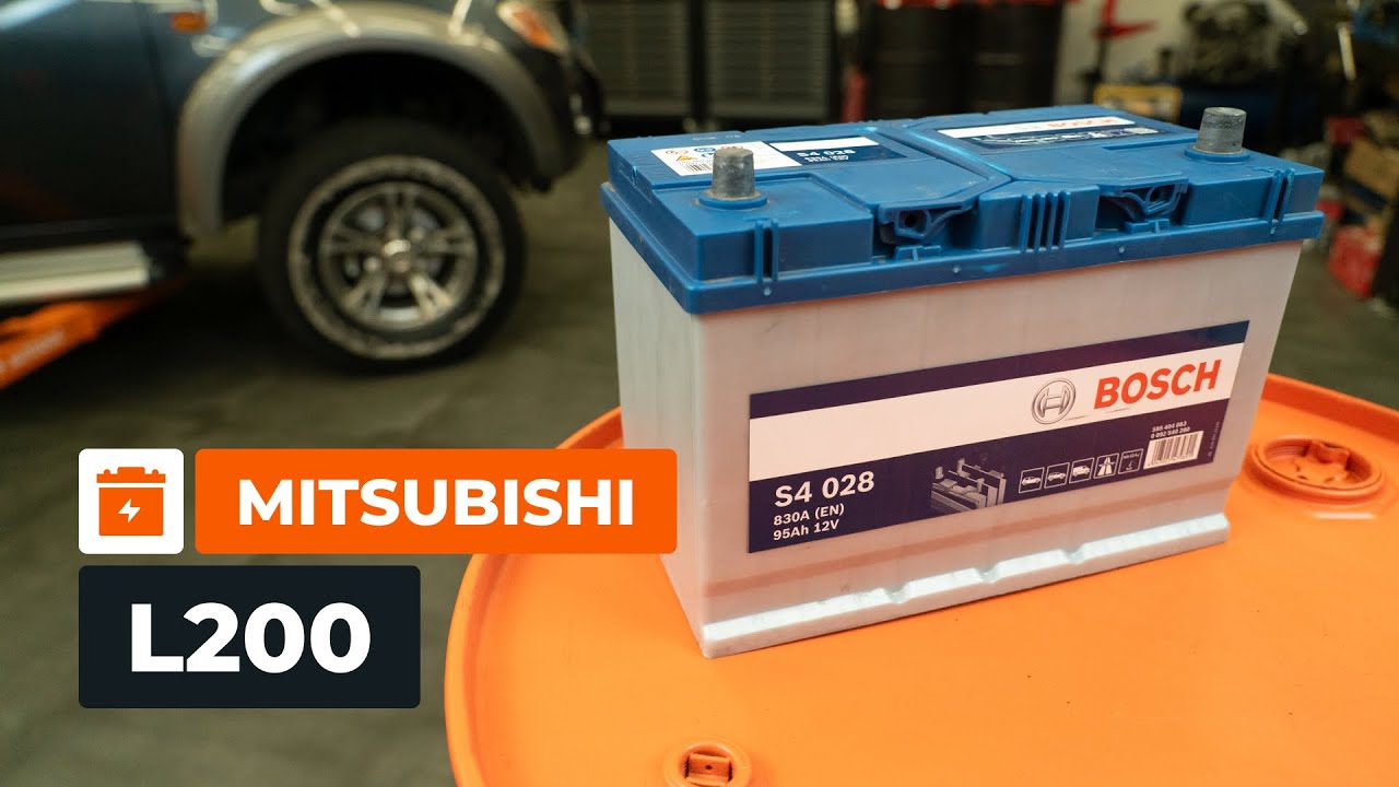 Kuinka vaihtaa akku MITSUBISHI L200 KA -autoon [AUTODOC-OHJEVIDEO]