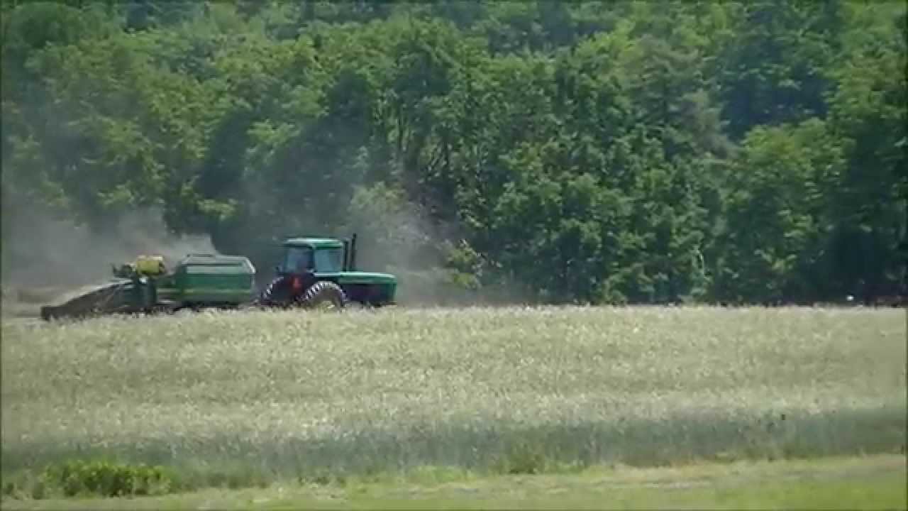 raking hay with jd 4230 and bailing hay with jd 4840