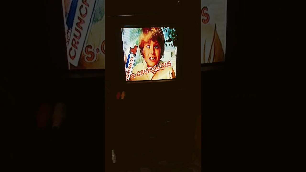 1980s nestle crunch commercial on old tv