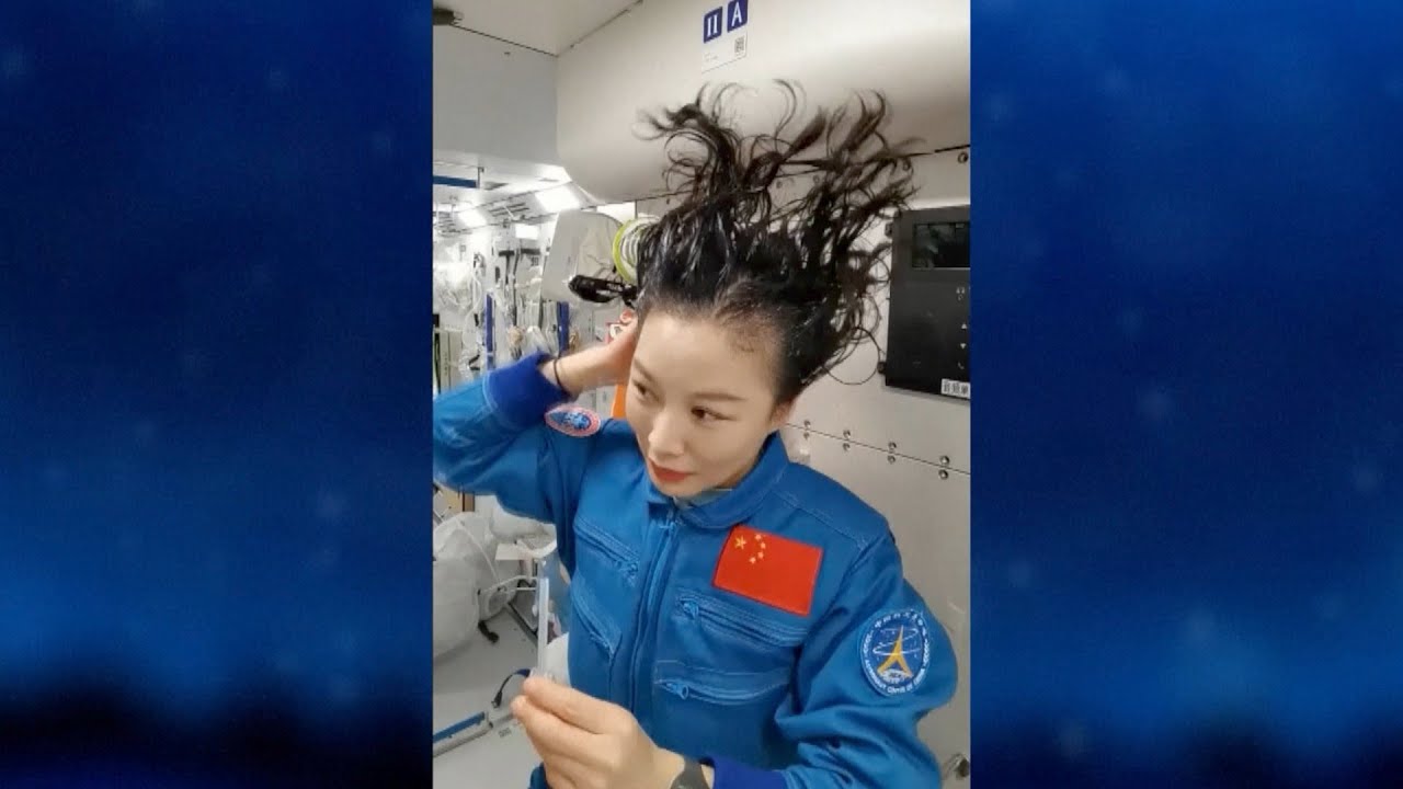 Taikonaut Wang Yaping demonstrates how to wash hair in space station
