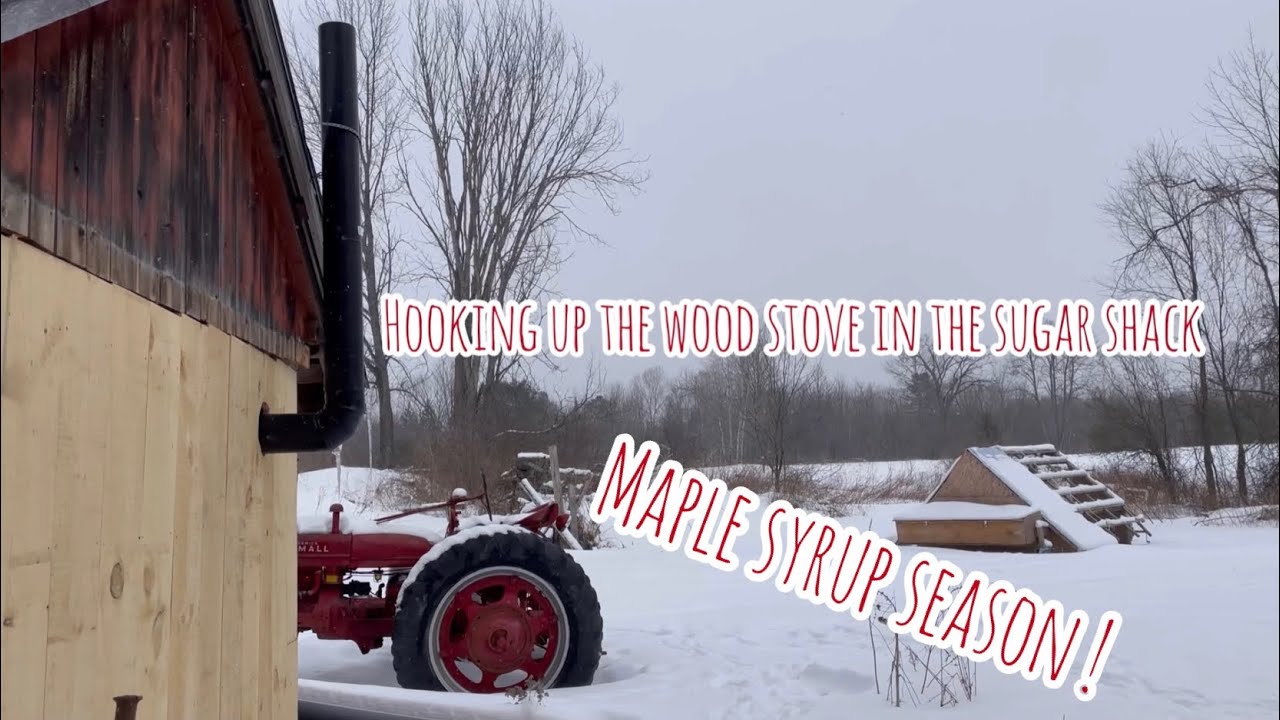 Installing stove pipe for the sugar shack. Maple Syrup Season is here!