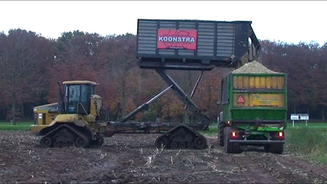 Maïs 2011 | Terragator 2104 op rupsen met hooglosser en Claas Jaguar 870 op rupsen | Extreme wet