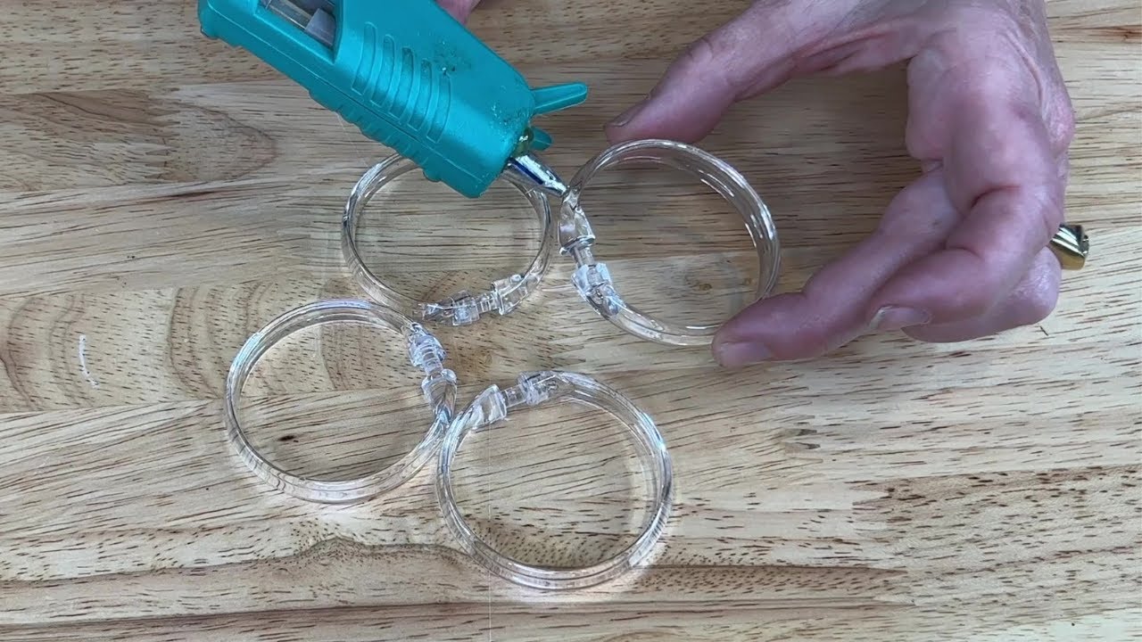 The genius reason she glues 4 shower curtain rings