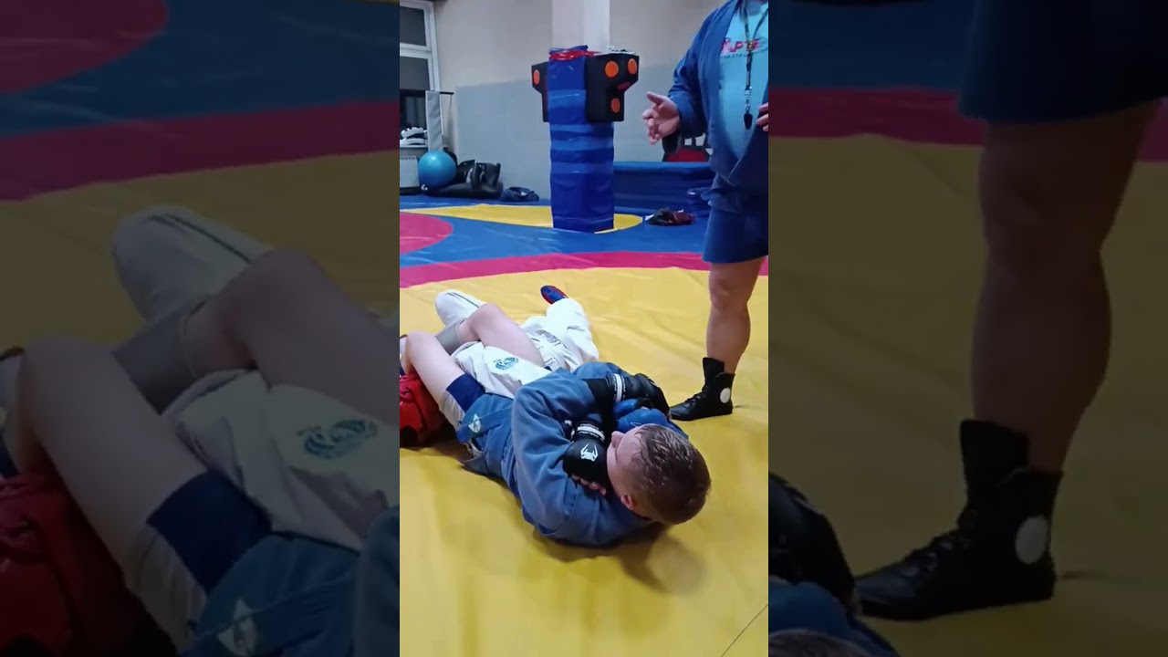 Самбо. Партер. Уход от удержания сбоку с выходом на болевой головой к ногам.