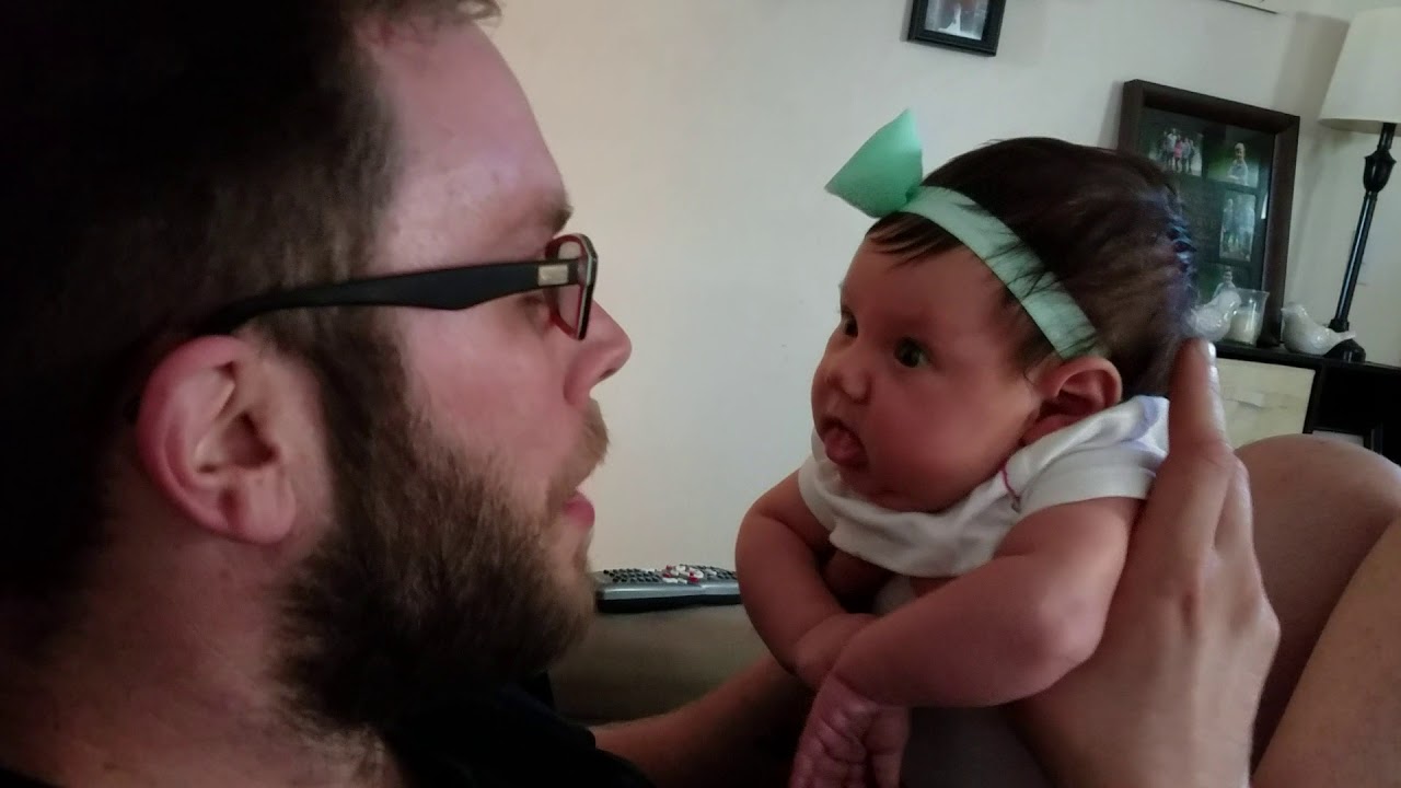 Baby Lucy smiling from Daddy's kisses