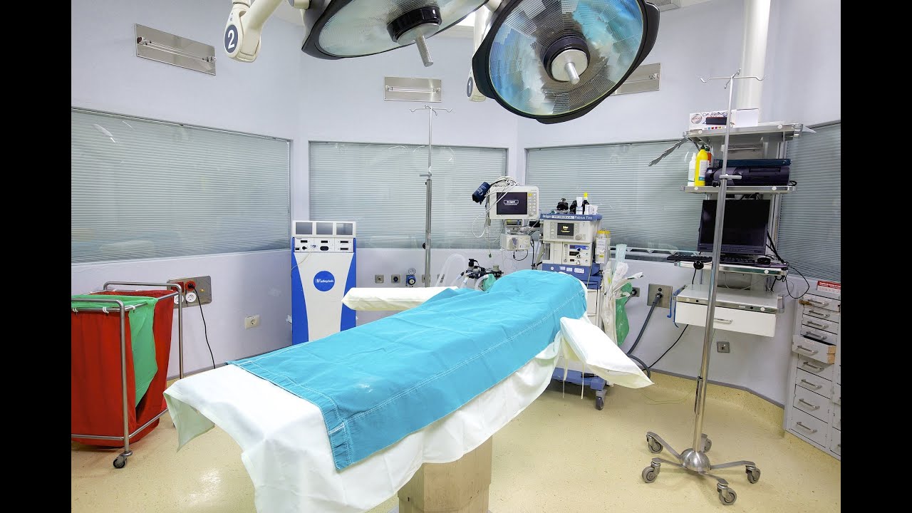 Putting on a sterile gown and gloves