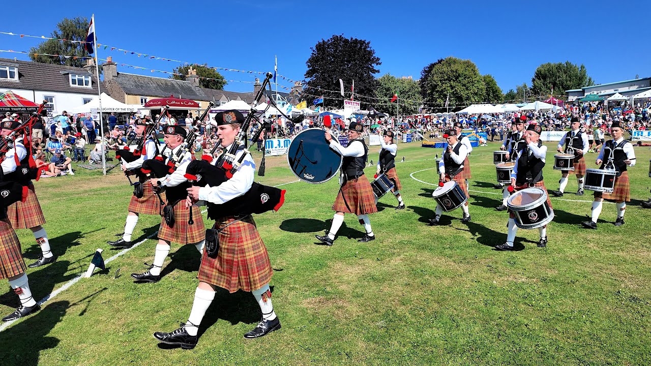 Comrie Pipe Band march out playing Bonnie Galloway at 2025 Crieff Highland Gathering in Scotland