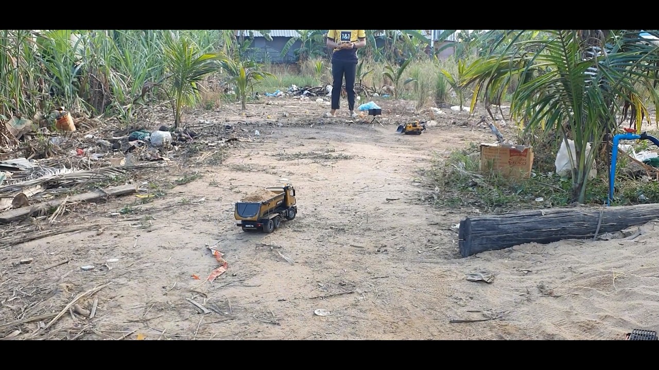 Miniature Earthworks: RC Dump Truck and Excavator in Action