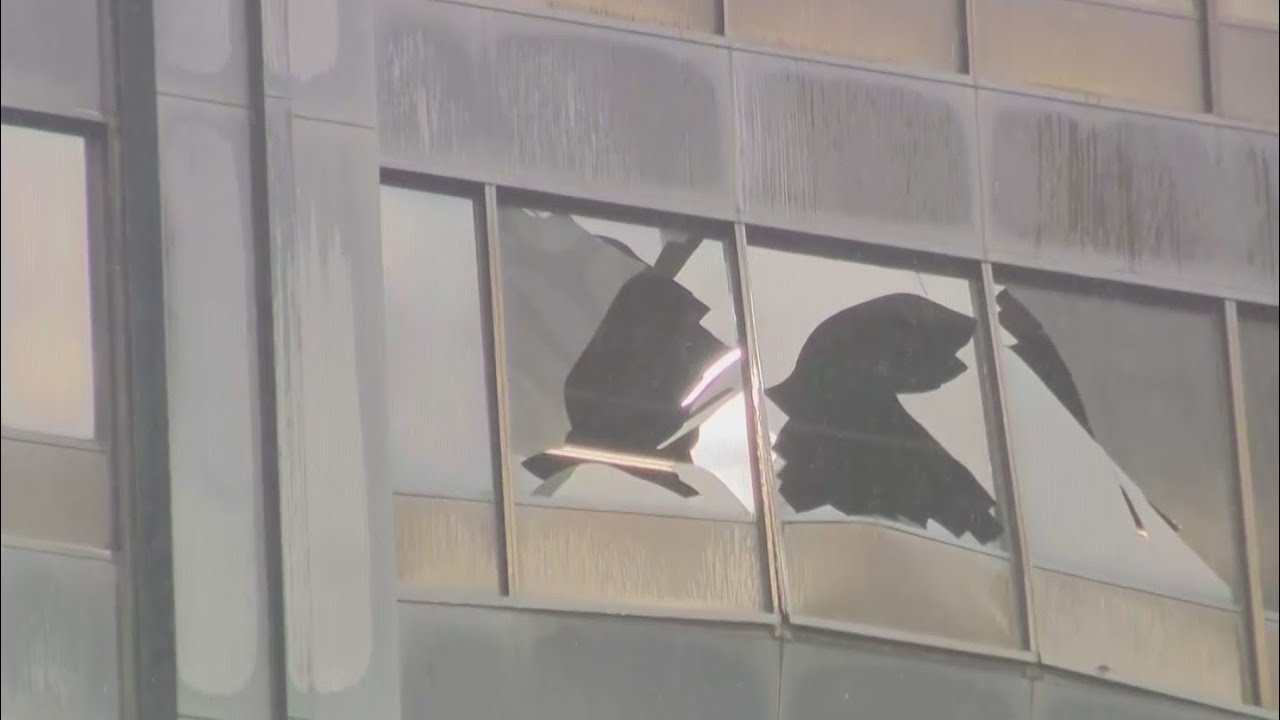 Car backs into, damages windows at former John Hancock Center