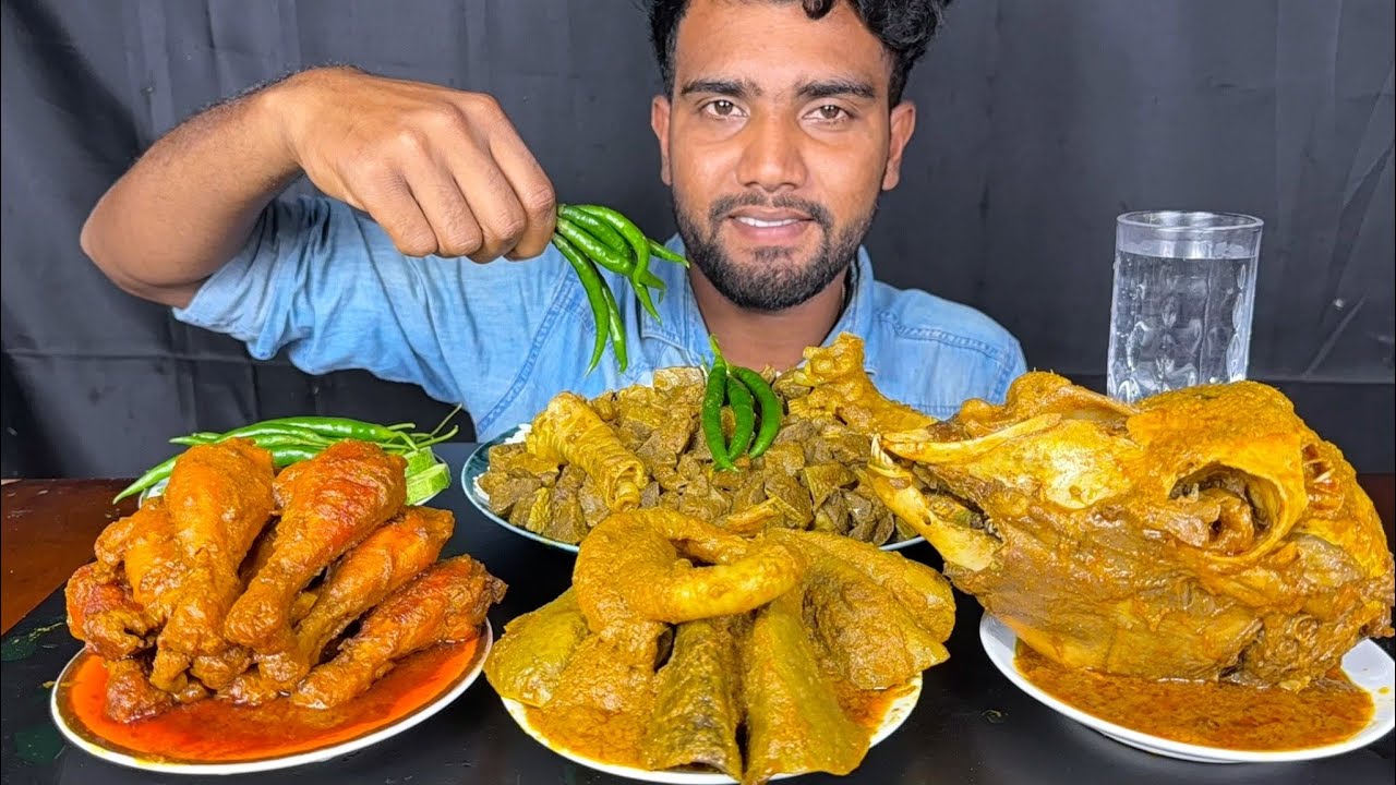 spicy chicken leg piece curry, full goat head, full mutton lungs and mutton liver curry with rice