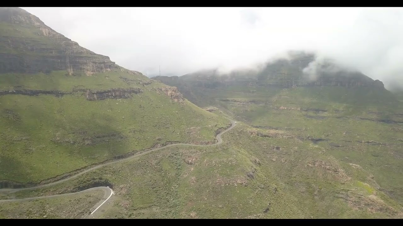 Winding Mountain Road Through the Clouds &mdash; Aerial View