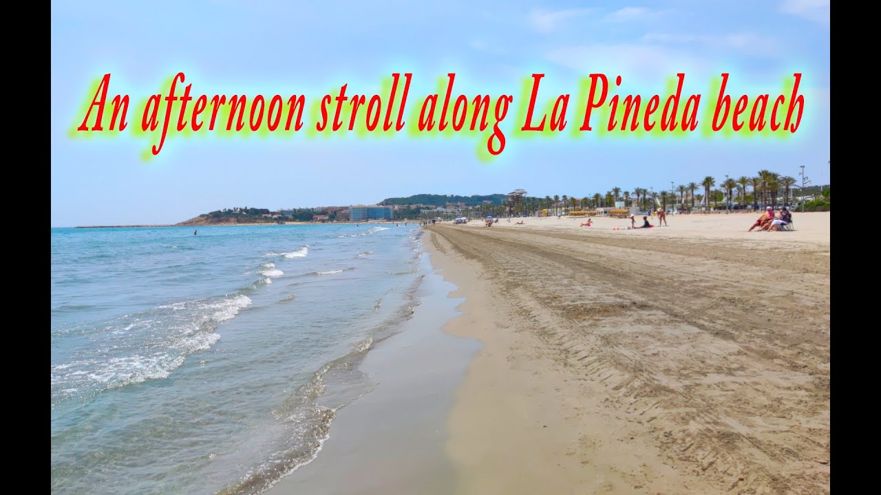 Great walk along beautiful La Pineda beach Spain