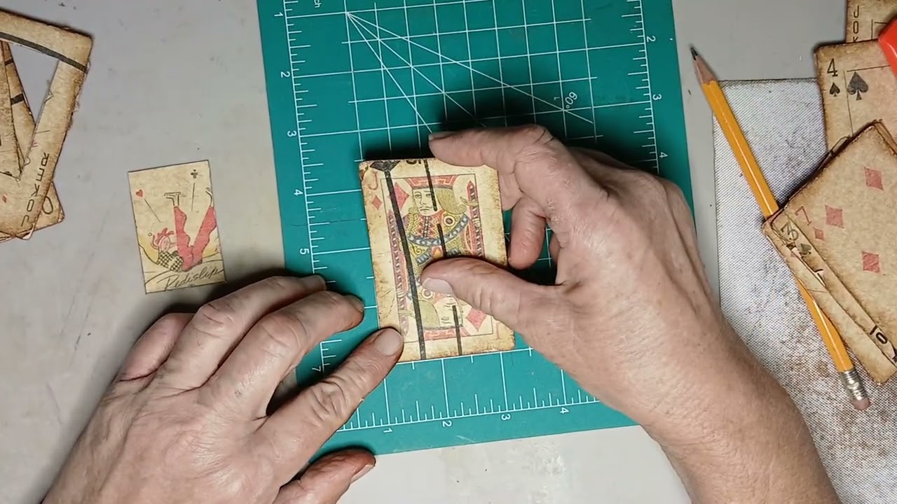 Cutting a covered card to make a frame and a decorated mini 6 page book