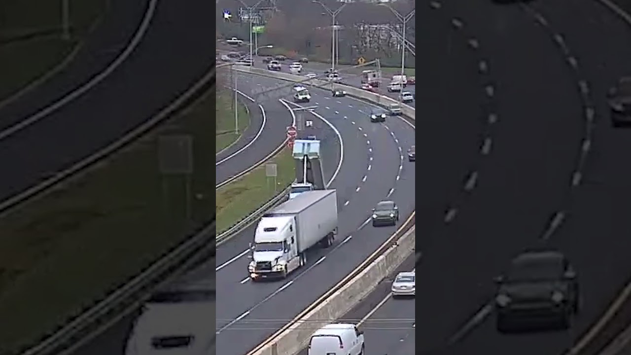 Dump truck slams into overhead highway sign in Ohio