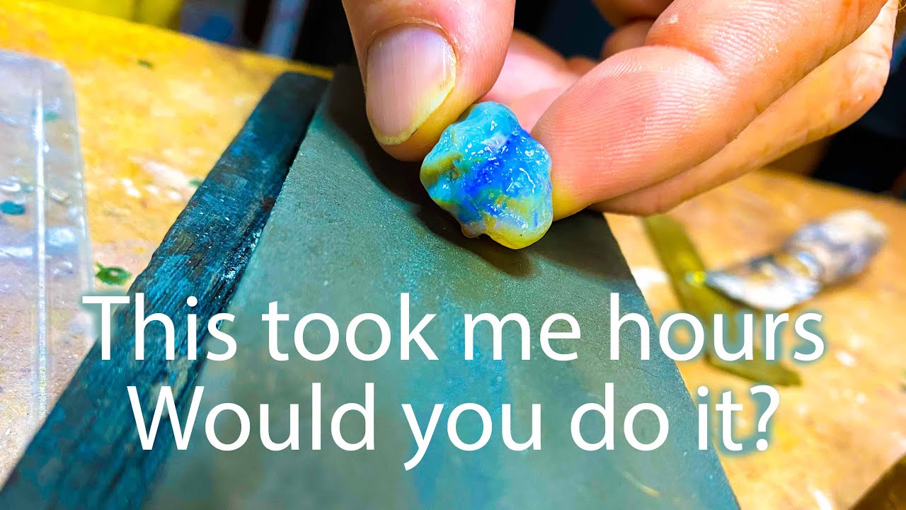 Hand polishing opal using sand paper