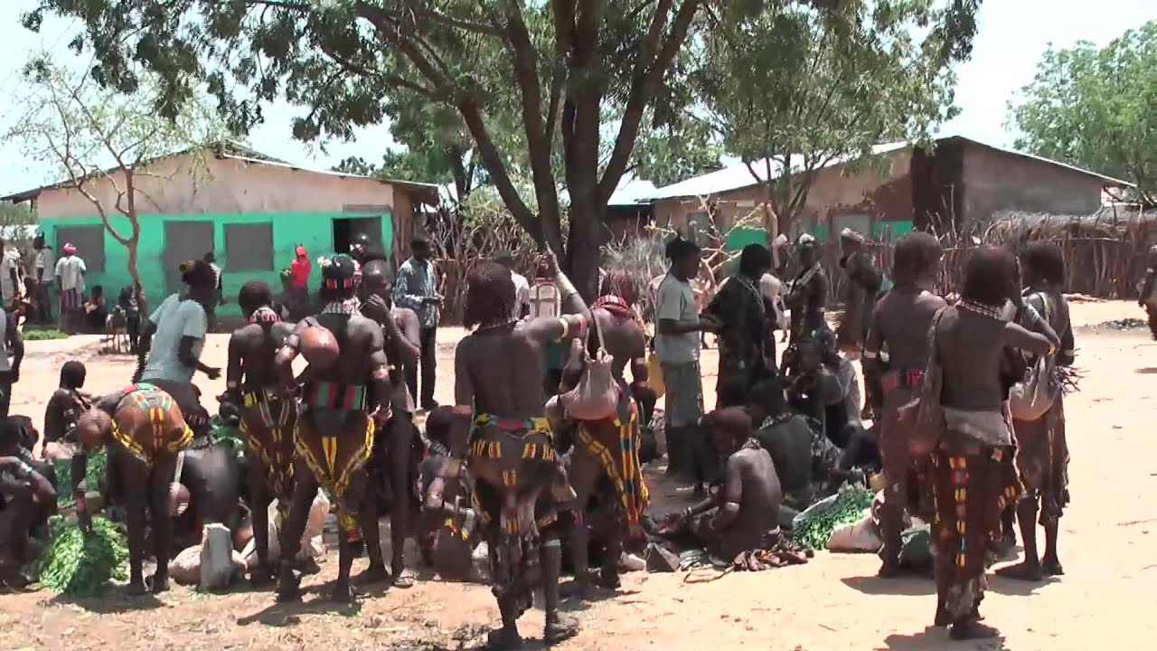 Hamer people and Karo tribe - native African tribes meet at Turmi market in Ethiopia