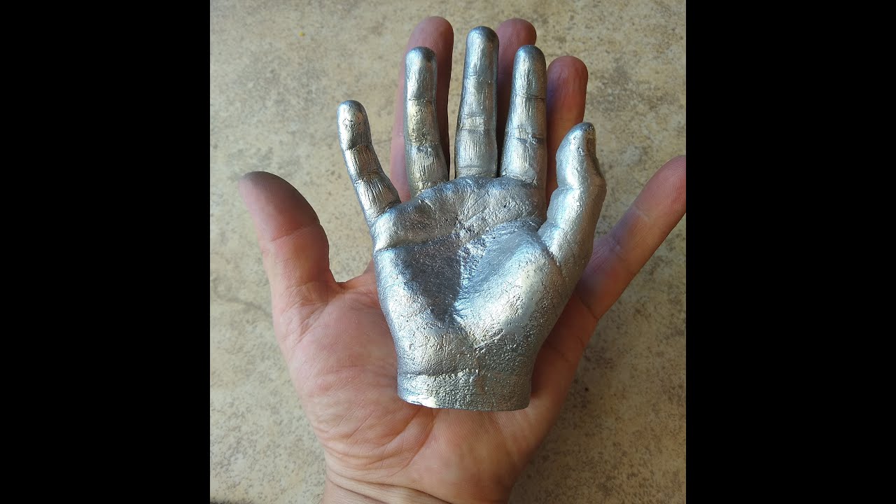 Casting aluminum hand using lost wax model.